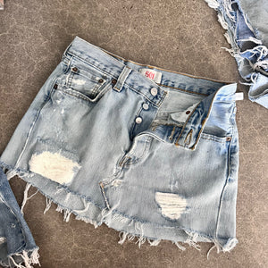 Destroyed Levi’s reworked mini skirt 14” flat lay