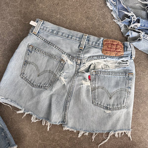 Destroyed Levi’s reworked mini skirt 14” flat lay